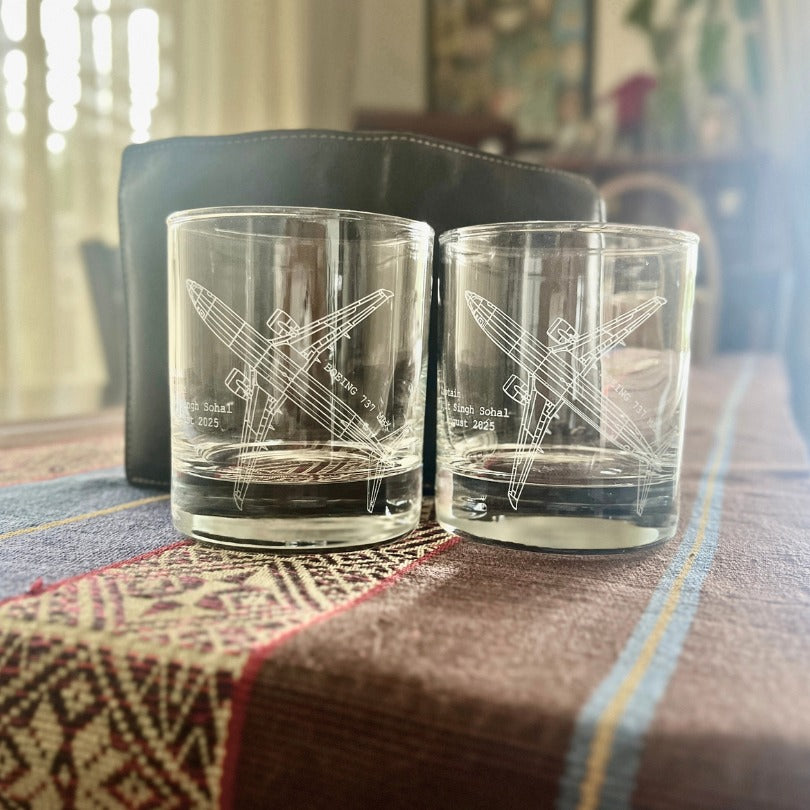 glasses engraved with boeing 737 aircraft