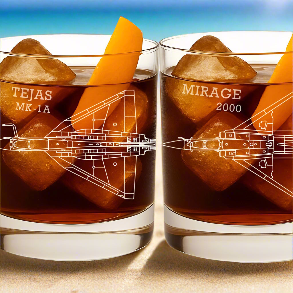 Two glasses with ice cubes and airplane designs, labeled 'Tejas MK-1A' and 'Mirage 2000'.