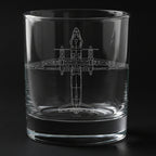 Clear glass tumbler with an an32 military airplane etching on a black background