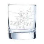 Clear glass with apache helicopter etching on a white background