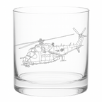 Clear glass tumbler with a helicopter etched on it against a white background