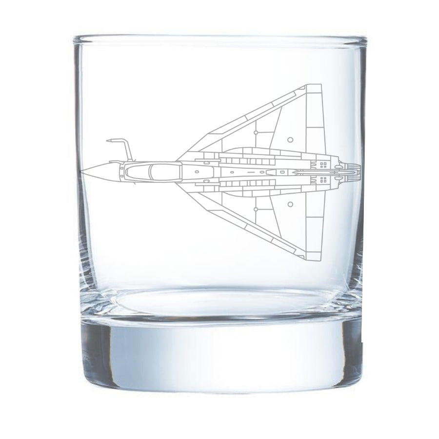 Clear glass tumbler with a tejas aircraft design etched on it, on a white background