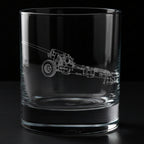 Clear glass tumbler with engraved M-46 130mm Field Gun, on a black background