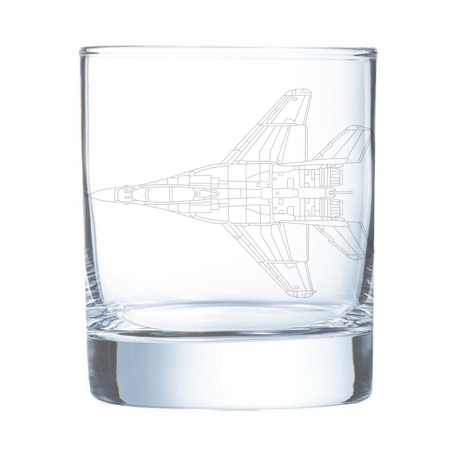 Clear glass tumbler with an Mig-29 airplane blueprint etched on it against a white background