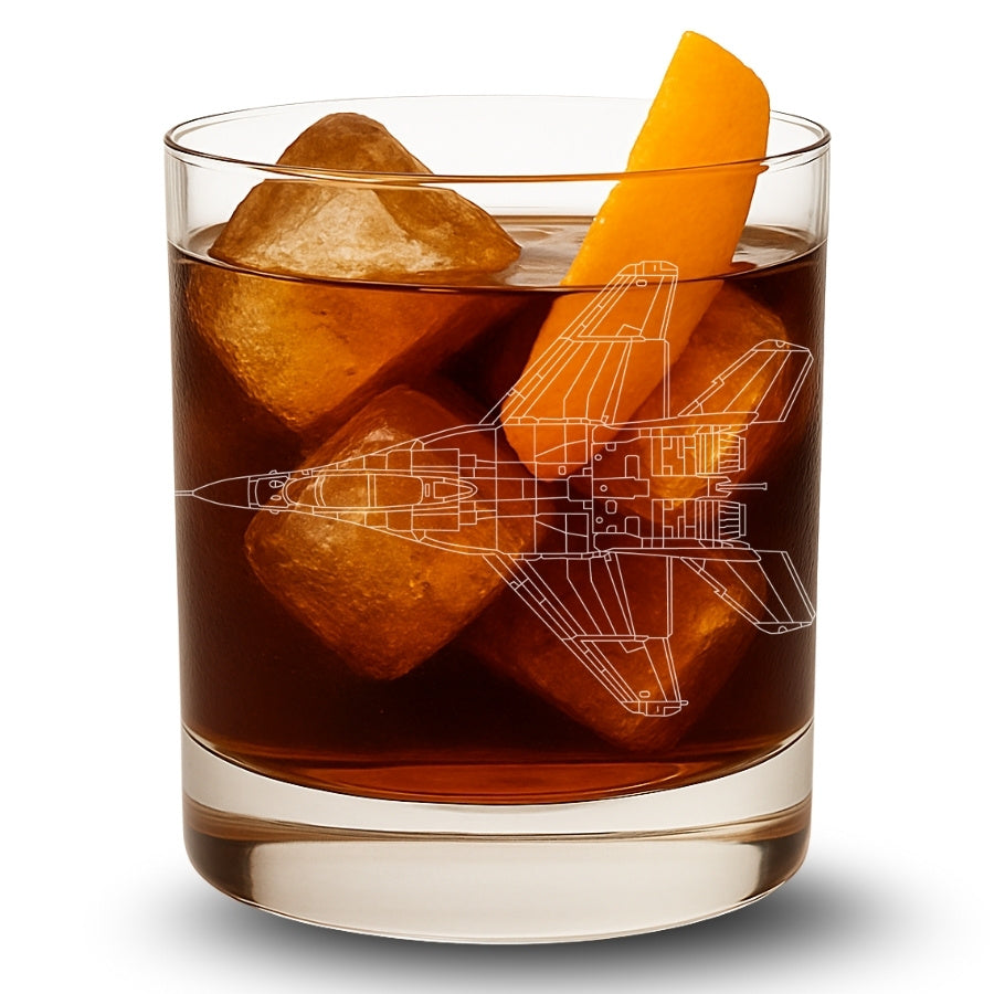 Glass of iced drink with an orange slice and a Mig-29 airplane blueprint engraved in a clear glass.