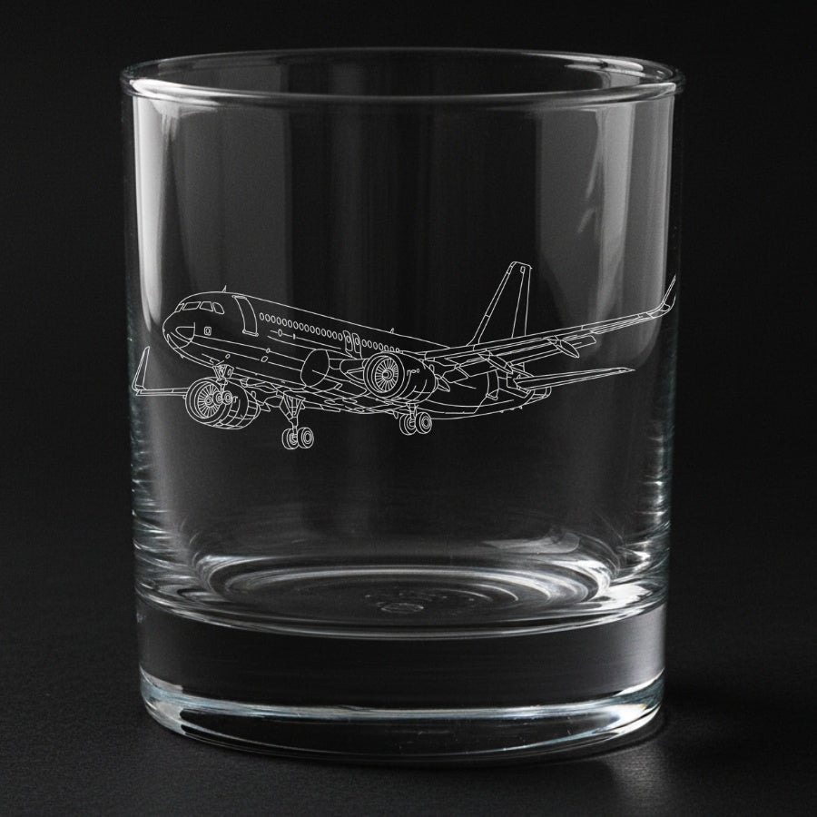 Clear glass tumbler with an airbus A320 airplane etching on a black background