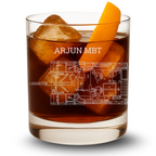 Glass of brown liquid with ice and an orange slice, featuring 'ARJUN MBT' battle tank from Indian Army.