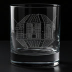 A clear glass rocks tumbler with an etched white line drawing of india's first satellite - the aryabhata from ISRO