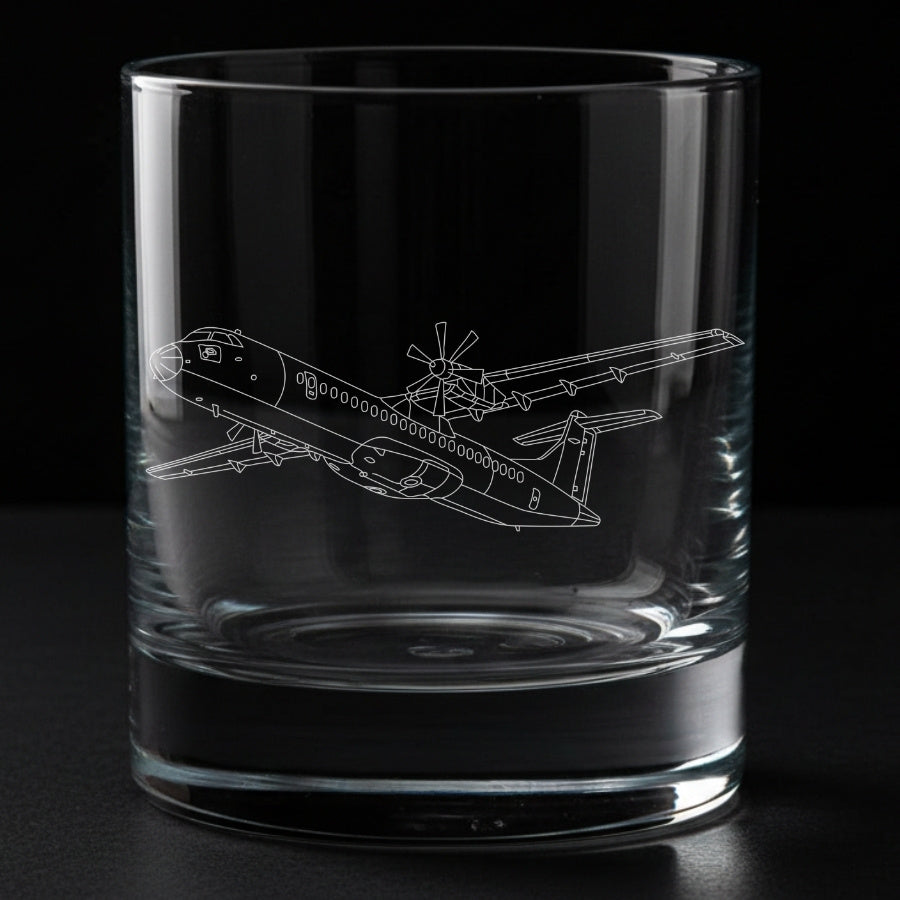 Clear glass tumbler with an atr-72 airplane engraving on a black background