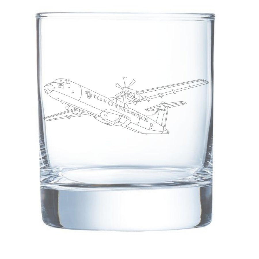 a clear glass whisky tumbler with an atr-72 etched.