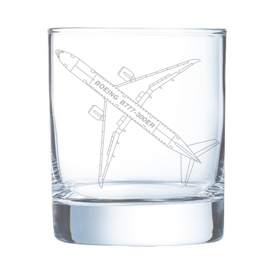 Clear glass tumbler with engraved airplane design on a white background