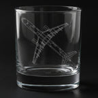 Clear glass tumbler with a boeing 757 airplane etching on a black background