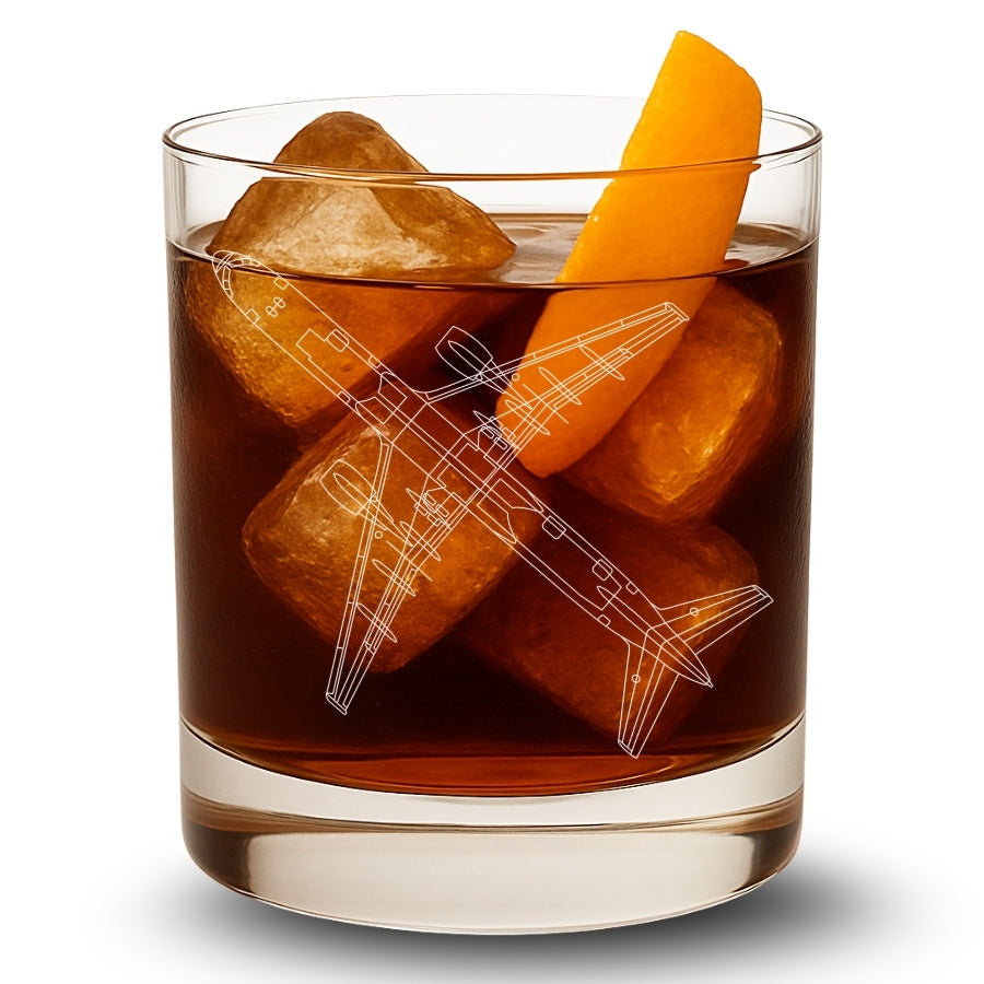 Glass of dark liquid with ice cubes and an orange slice, featuring a boeing 757 airplane designs on the ice.