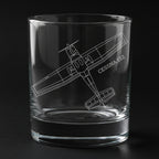 A cessna 152 aircraft engraved on a glass with a black background
