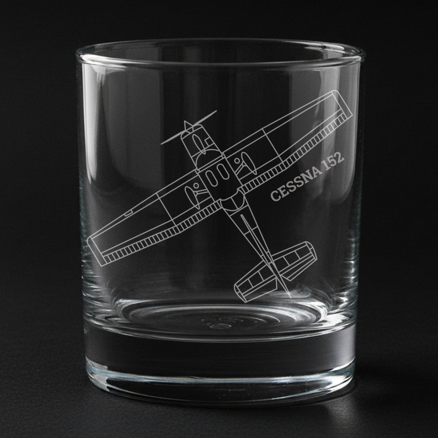 A cessna 152 aircraft engraved on a glass with a black background
