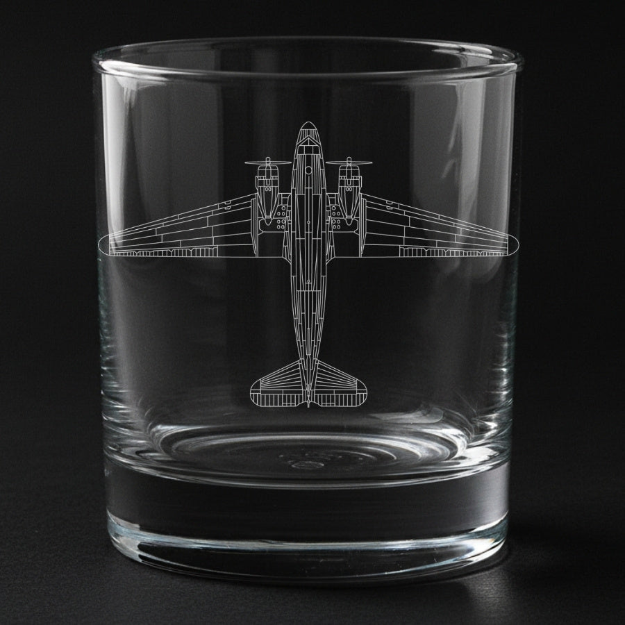 Clear glass tumbler with a douglas DC-3 Dakota airplane etching on a black background