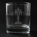Clear glass tumbler with a douglas DC-3 Dakota airplane etching on a black background