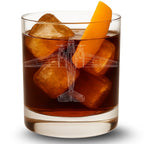 Glass of brown liquid with ice cubes and a DC-3 Dakota airplane design, on a white background