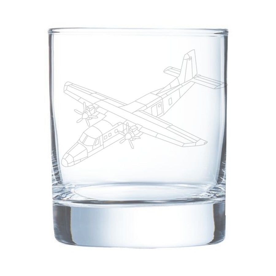Clear glass tumbler with a donier 228 airplane etching on a white background