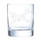 Clear glass tumbler with a donier 228 airplane etching on a white background