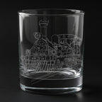 fairy queen locomotive engraved on a glass with a black background