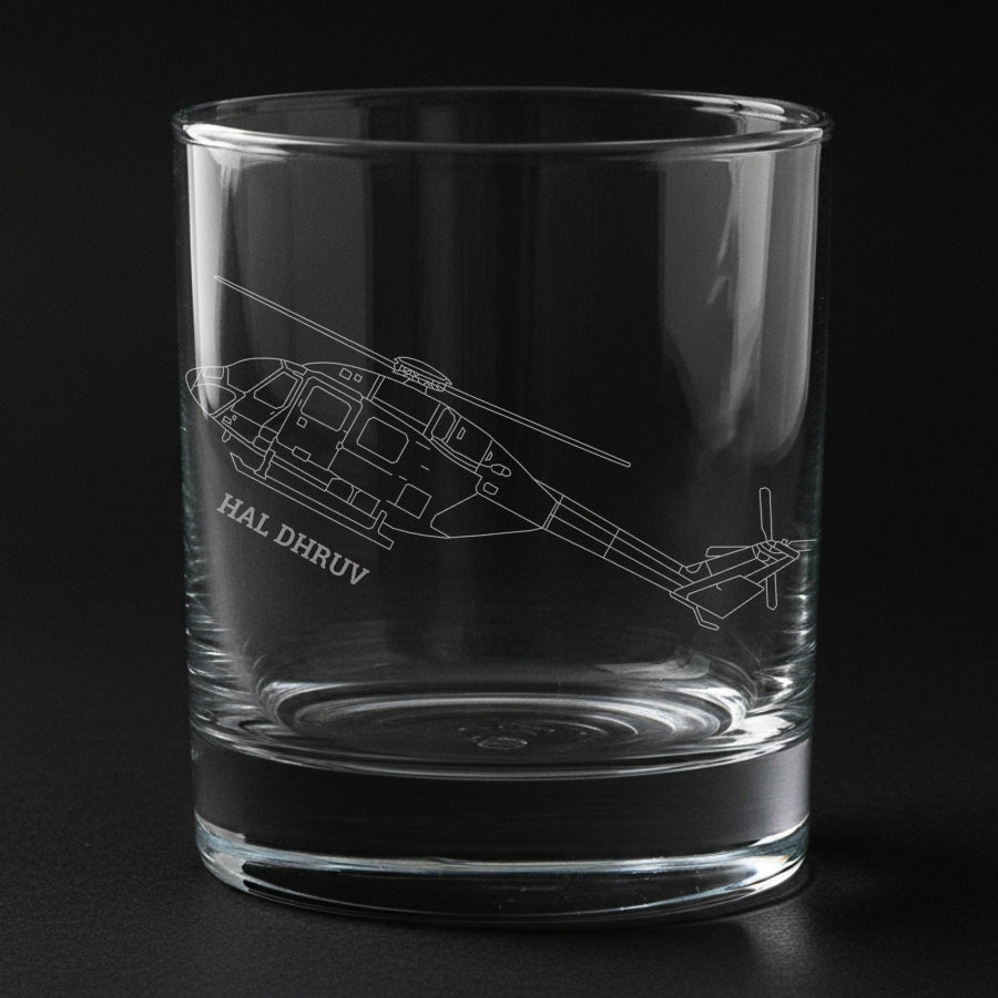 Clear glass tumbler with engraved helicopter design and 'HAL Dhruv' text on a black background