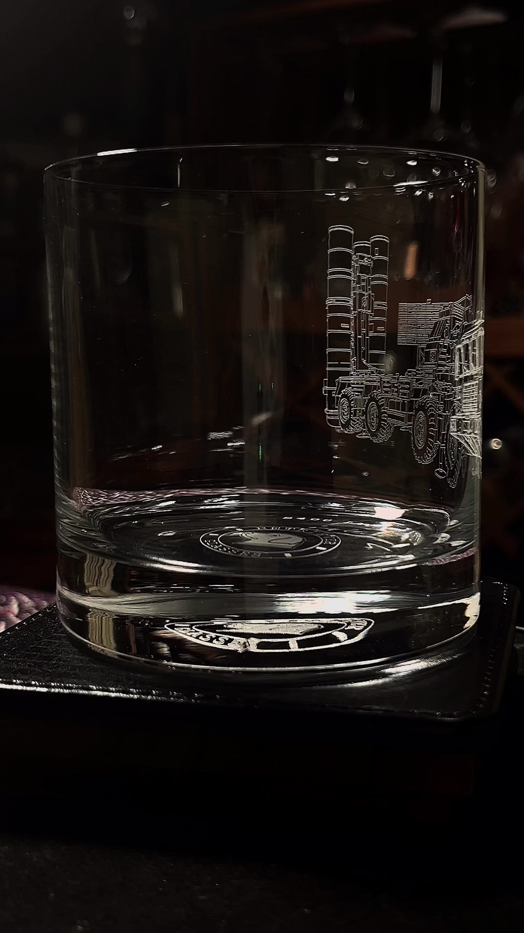 whiskey glass featuring a s400 launcher on a rotating table