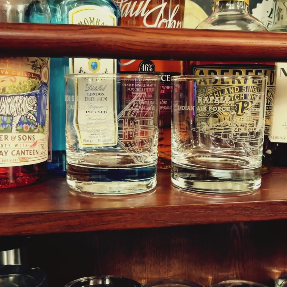 empty engraved glasses with Sukhoi su-30 and Rafale on the bar