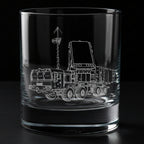 Clear glass tumbler with a detailed laser engraving of a s400 truck and 92n6a radar system on a black background