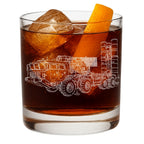 Glass with a s400 launcher engraving, ice cubes, and an orange slice on a white background