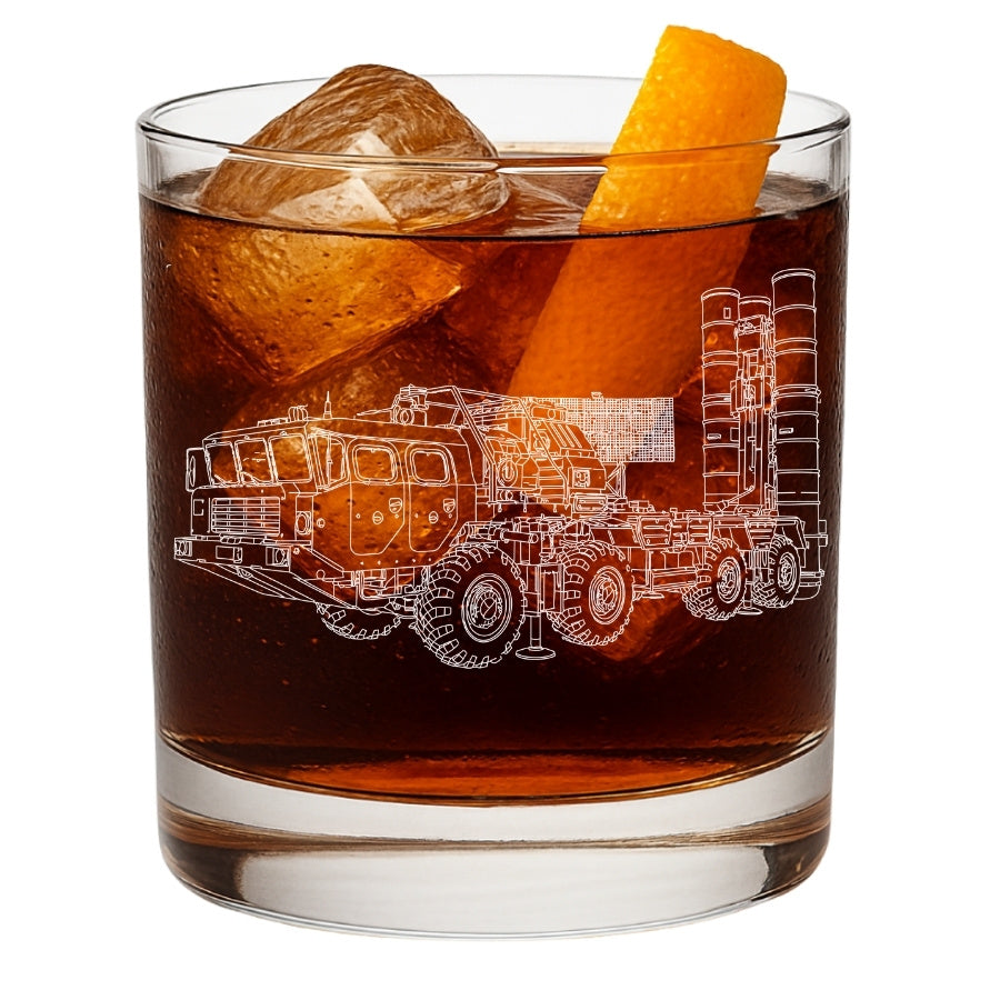 Glass with a s400 launcher engraving, ice cubes, and an orange slice on a white background