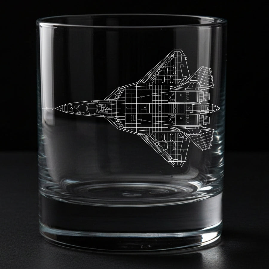 A glass engraved with a sukhoi su-57 aircraft on a black background