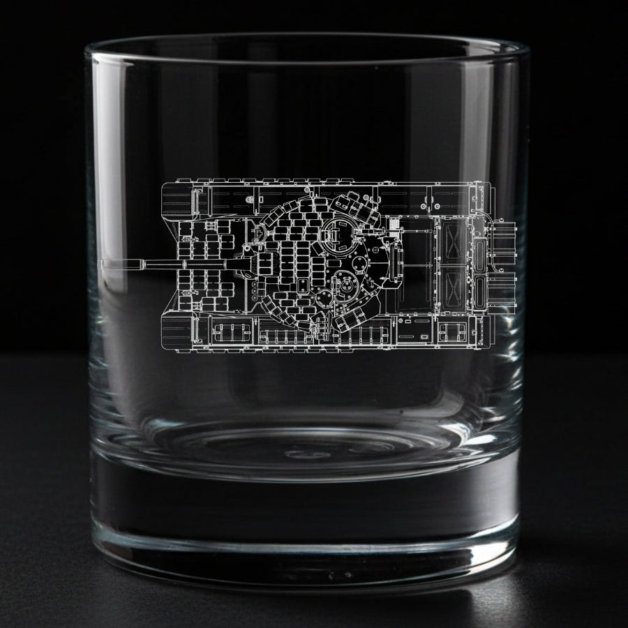 Clear glass tumbler with an engraved top view of a t72 tank blueprint on a black background