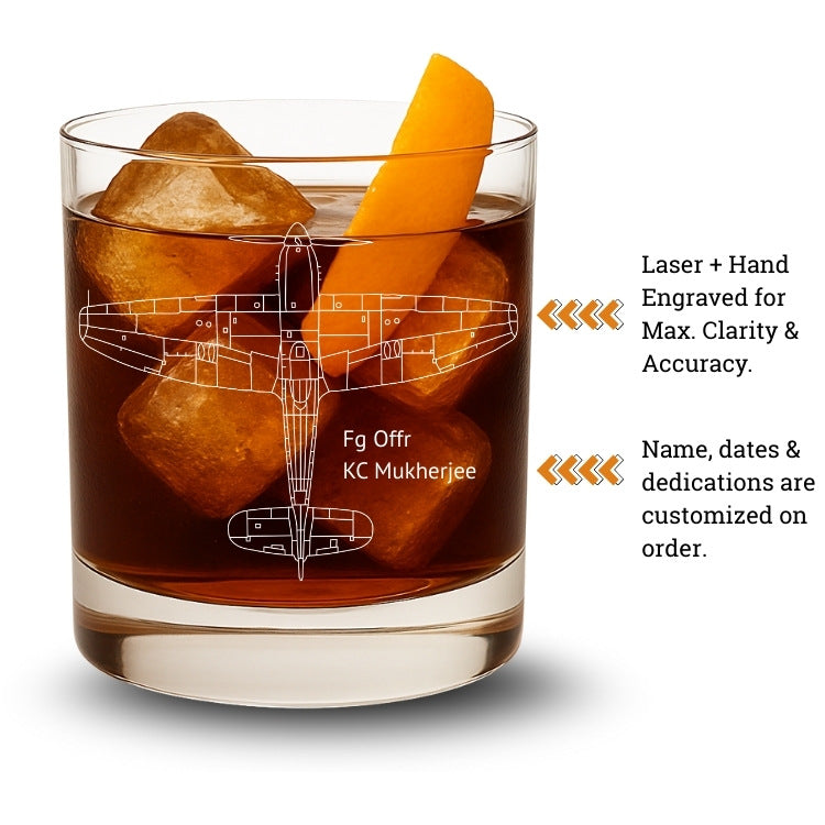 Glass with ice cubes and an airplane design, featuring laser and hand engraving with customized dedications on order.